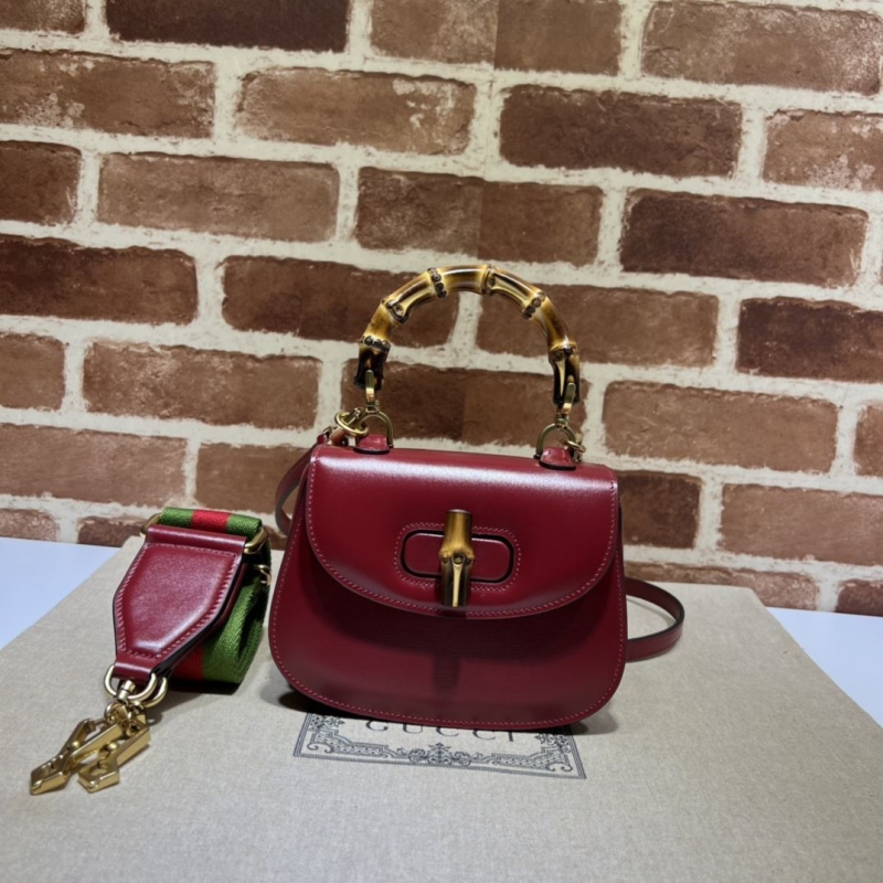 G*u*i top handle bags